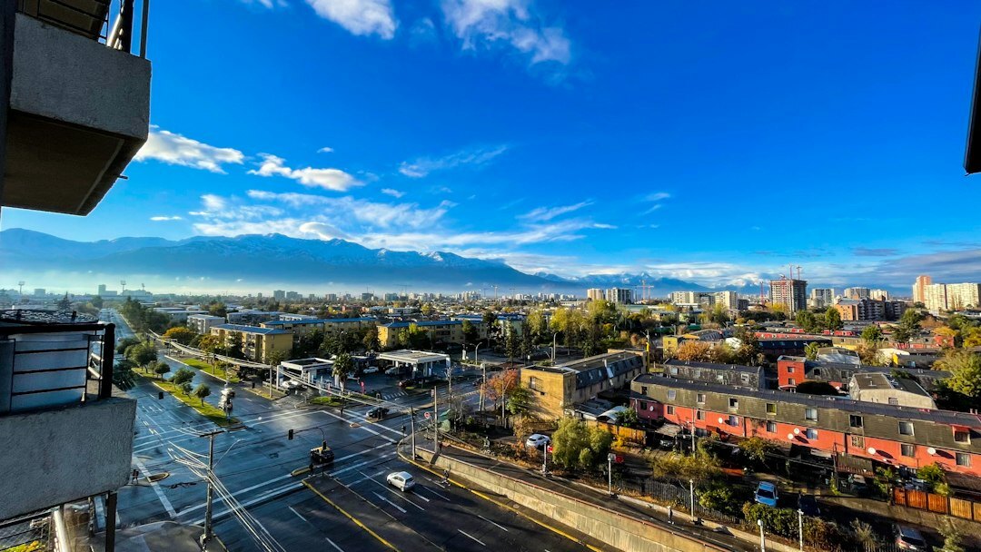 Documentary street photo of Santiago de Chile with pedestrians and Andes mountains in background