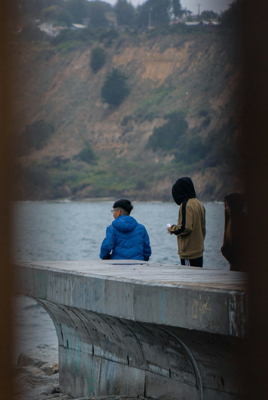 Portrait of a Chilean documentary photographer holding a camera